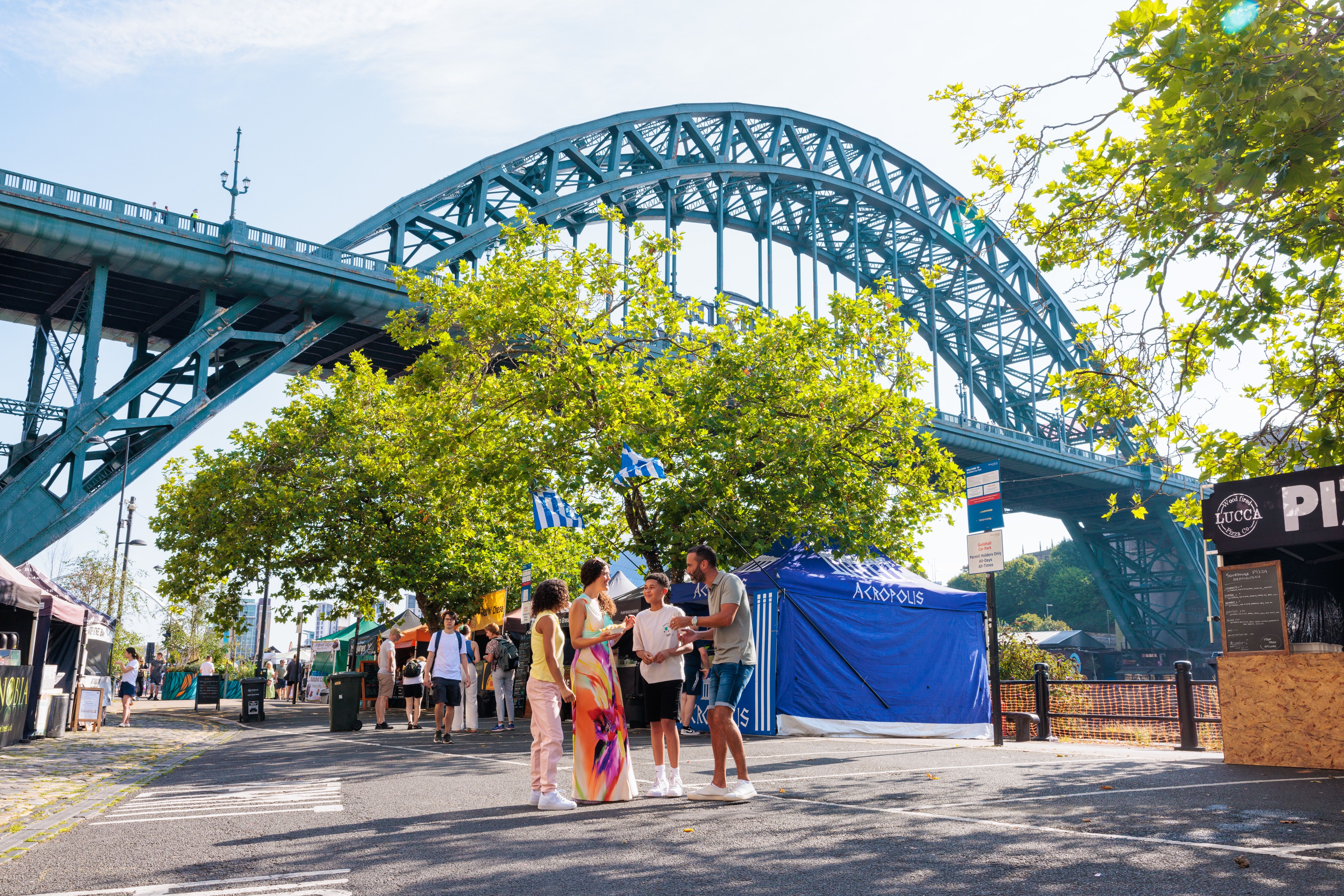 A family visit a Sunday market below the Tyne bridge, Newcastle upon Tyne