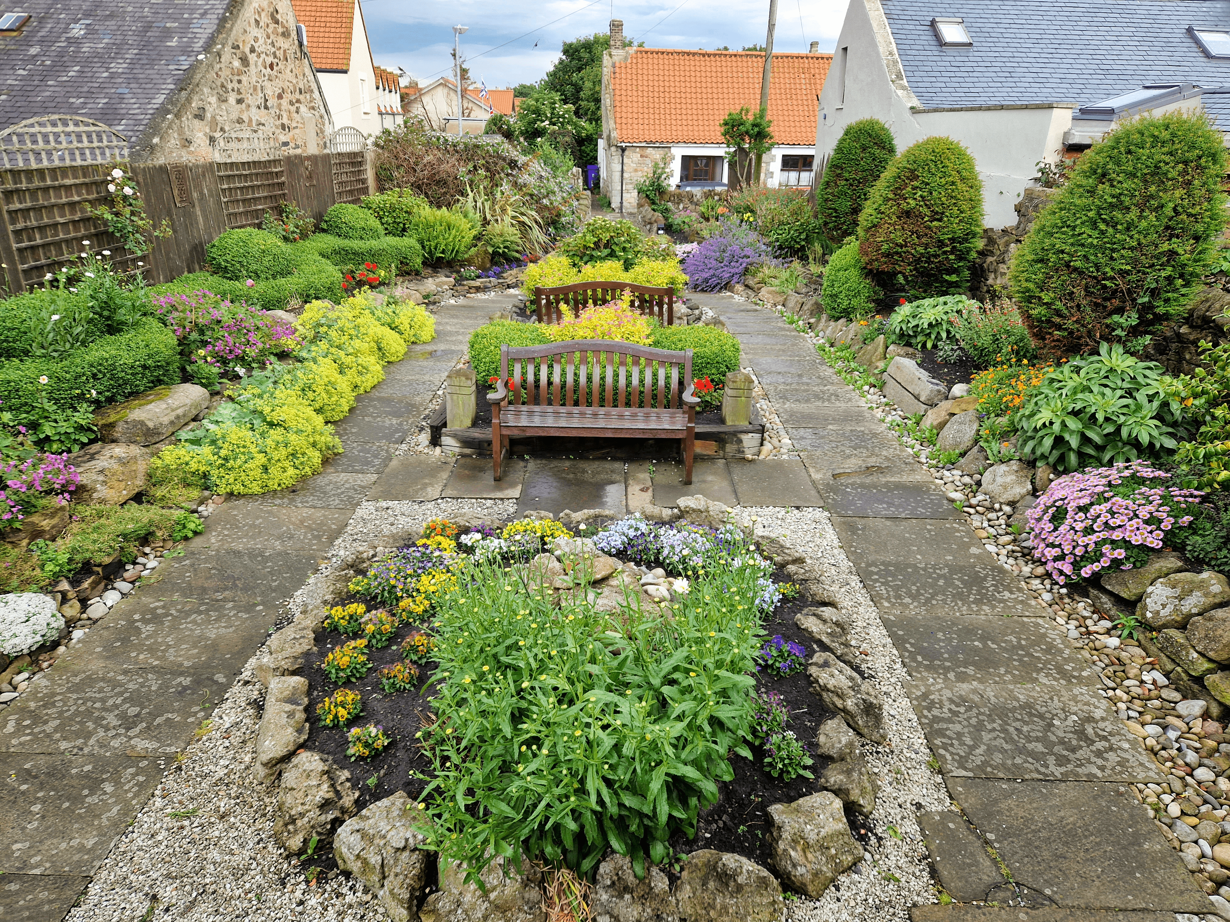 Lindisfarne Gospel Garden with benches and flora