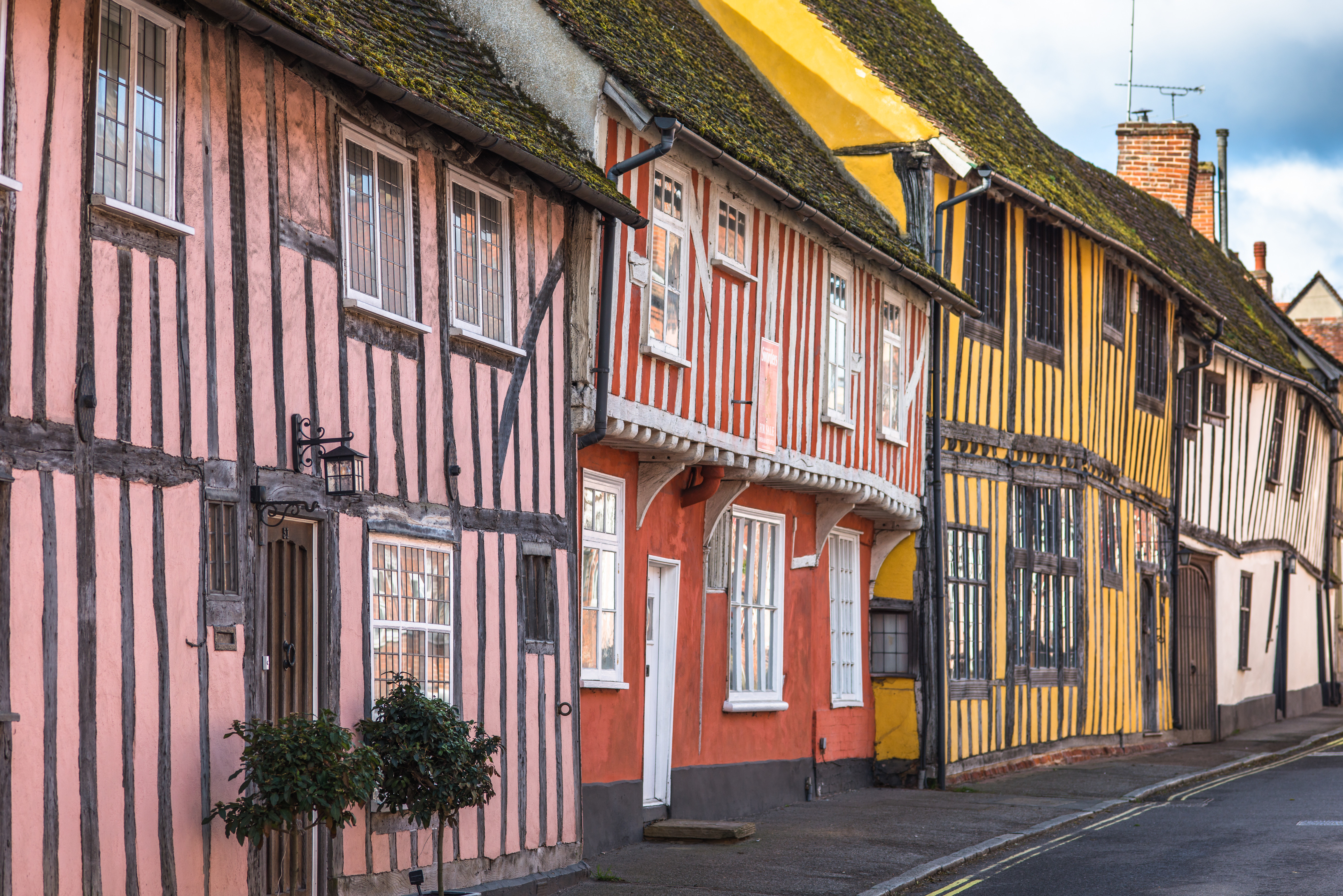 row of colourful timbered houses in Lavenham, Suffolk