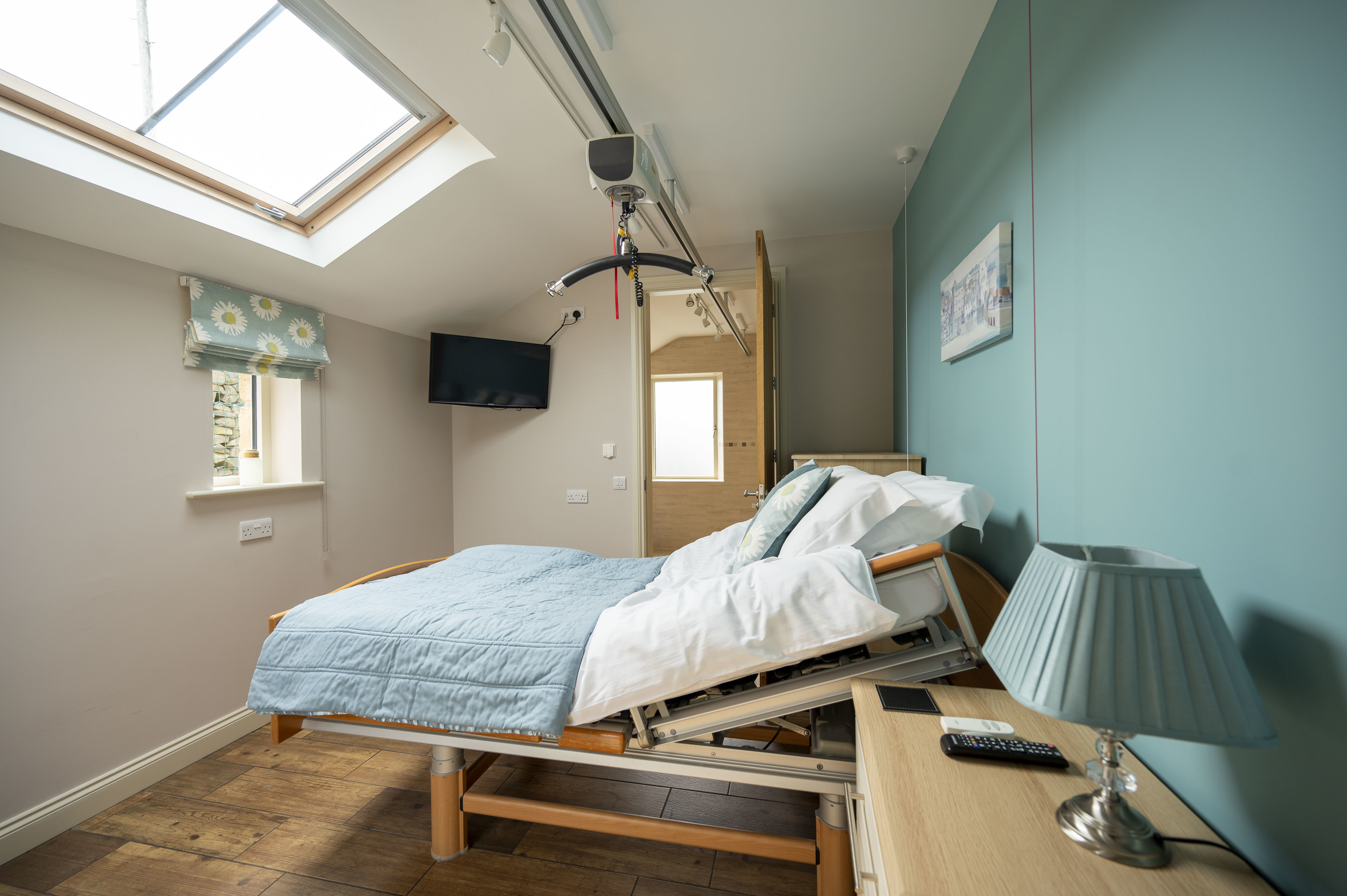 Adjustable bed with ceiling hoist in Sunday Cottage