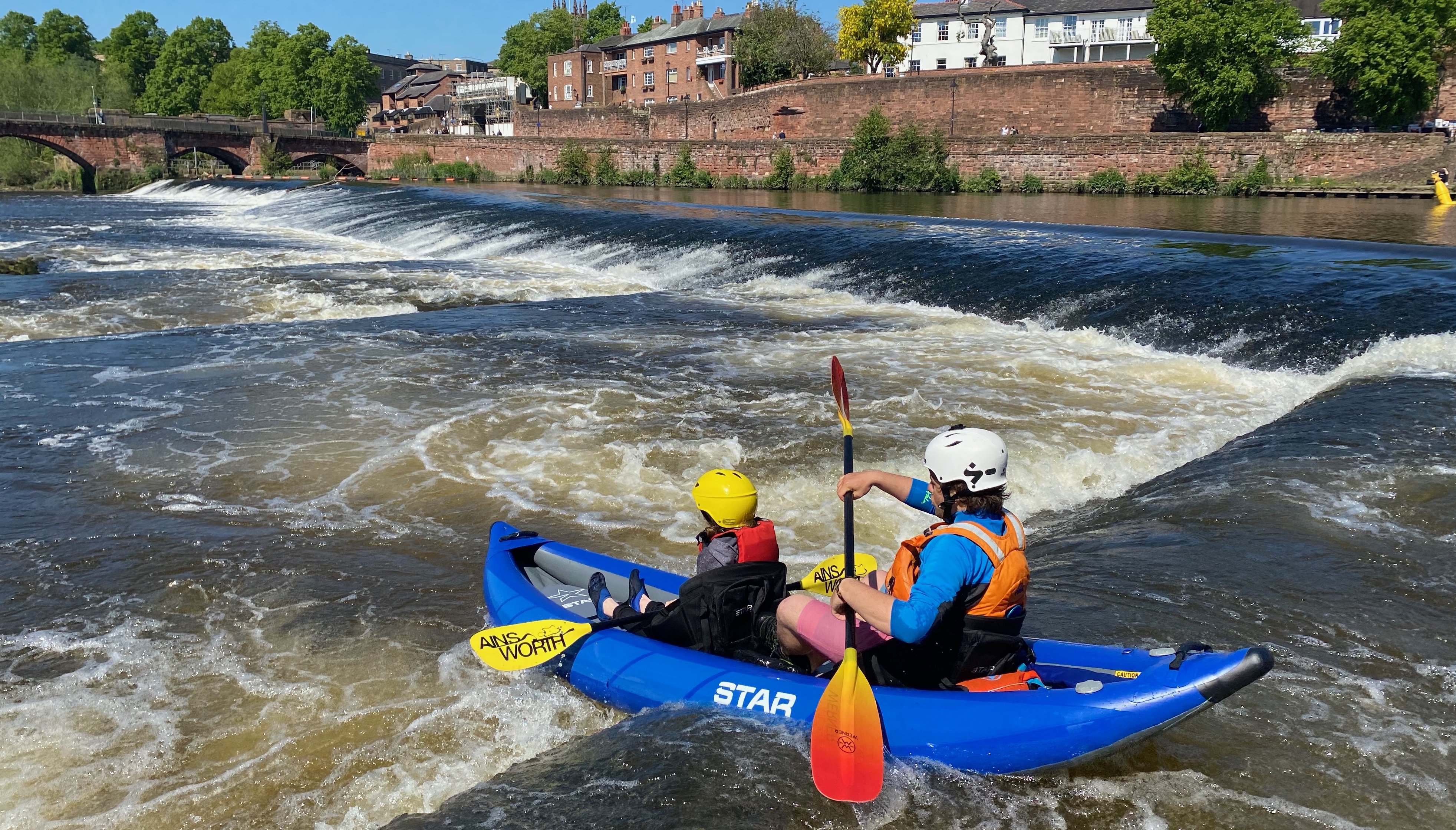 Kayakers navigating rapids in Chester
