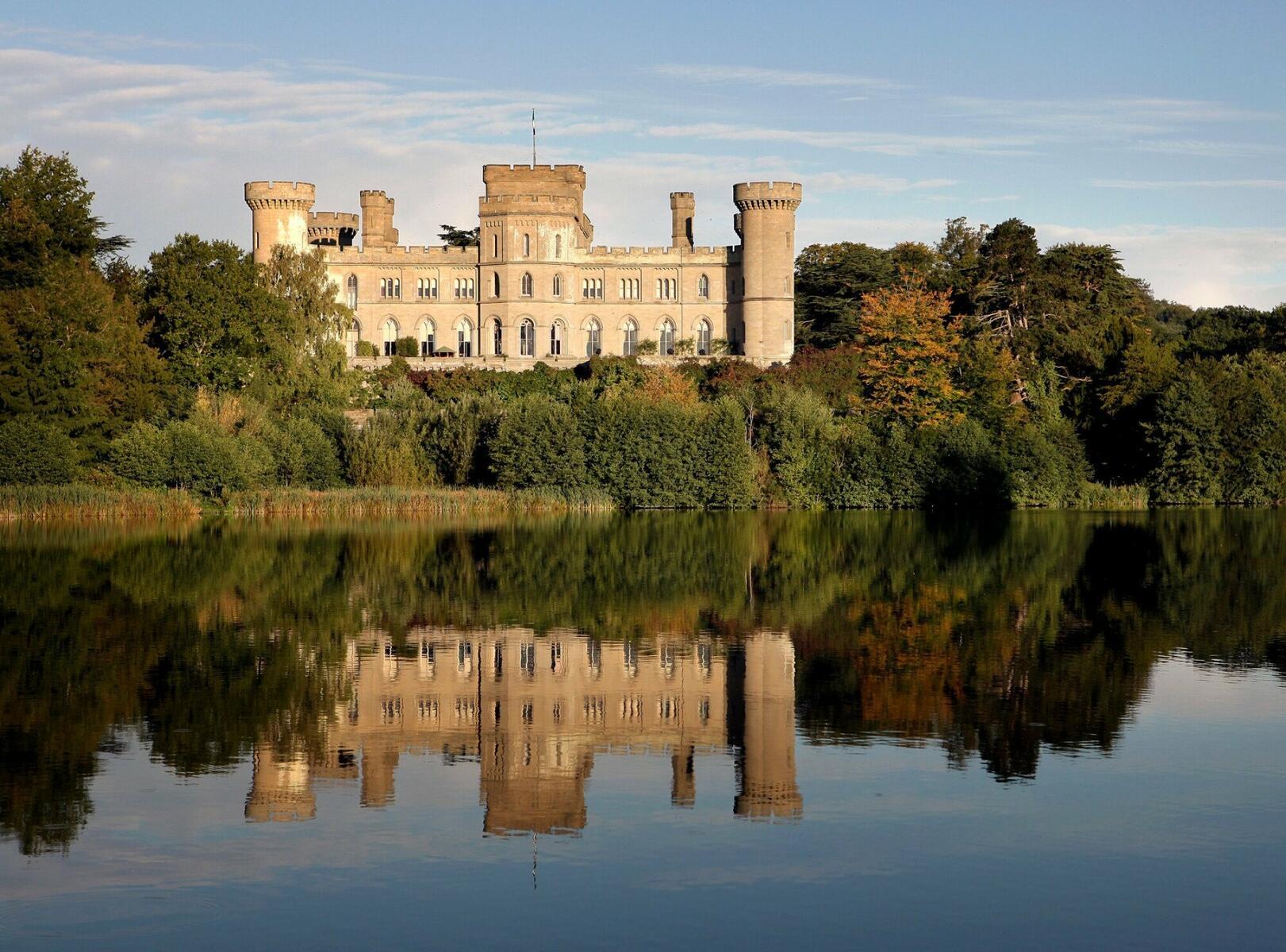 Eastnor Castle and its reflection in a lake