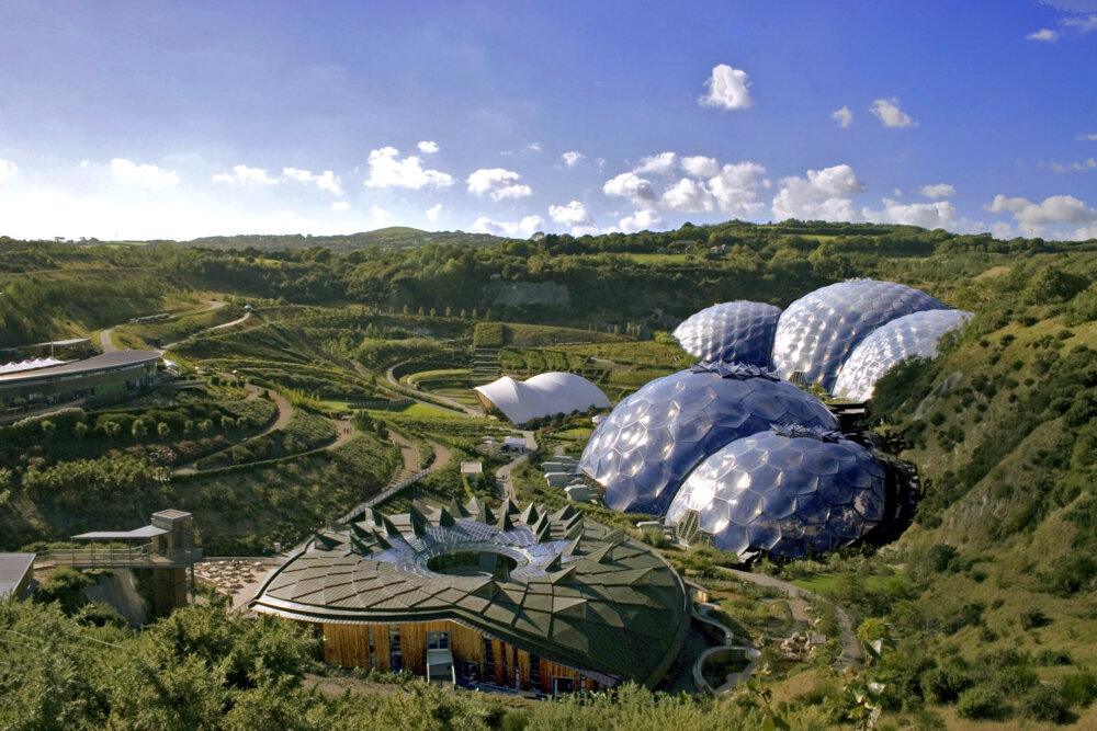 A landscape view of the biodomes at Eden Project on a sunny day