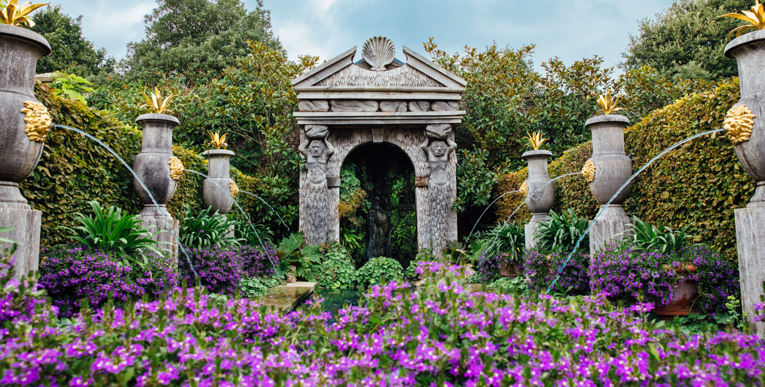 Earl's Court Garden with urn water features and arch, Arundel Castle, Arundel, West Sussex, England.