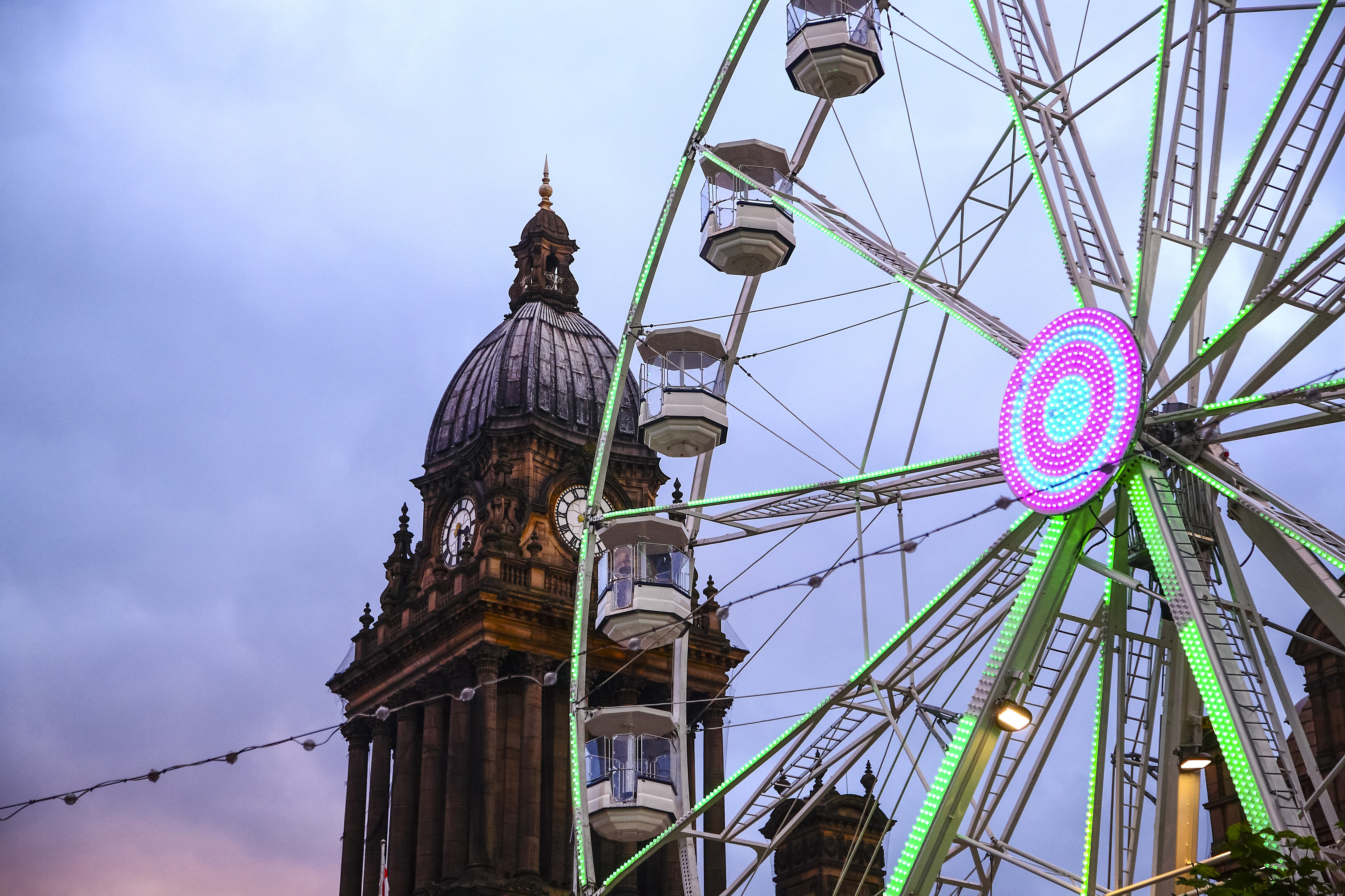 Looking up at Leeds Town Hall and The Observation Wheel at Dusk, Leeds, England