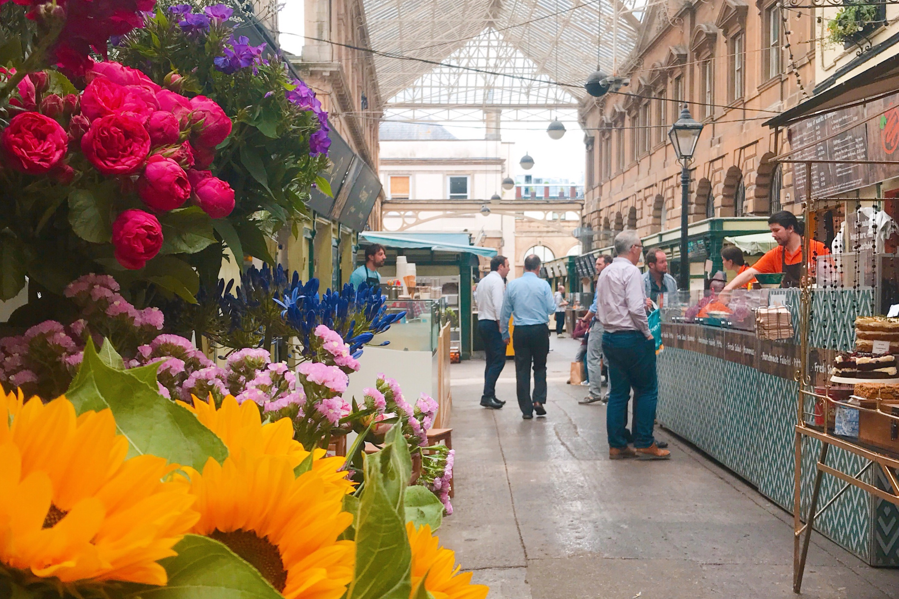 Flowers and market stalls at St Nicholas Market Bristol
