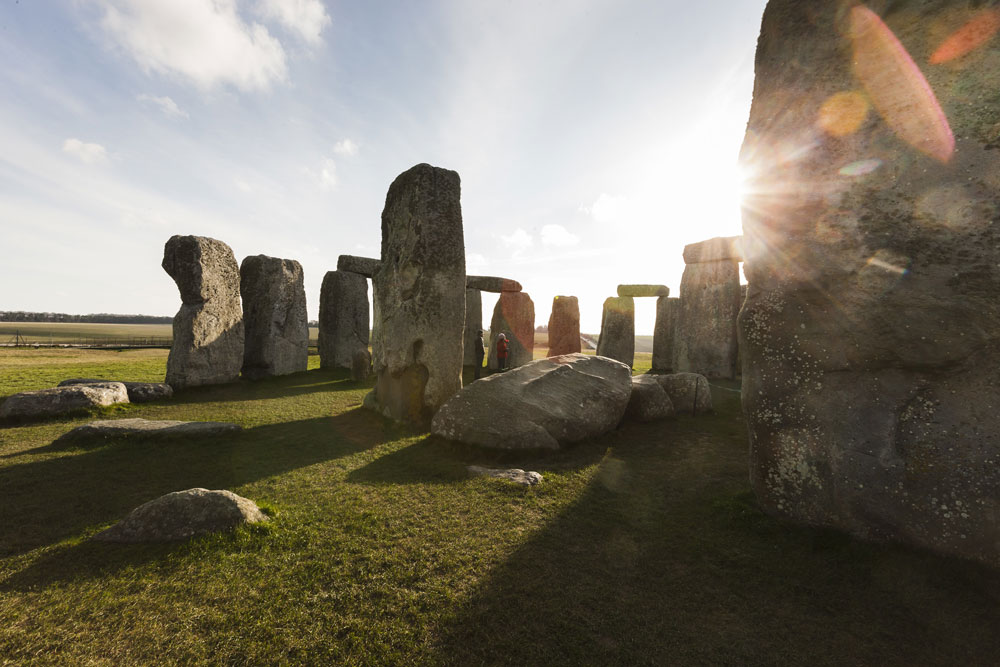 The sun breaks through a gap in Stonehenge