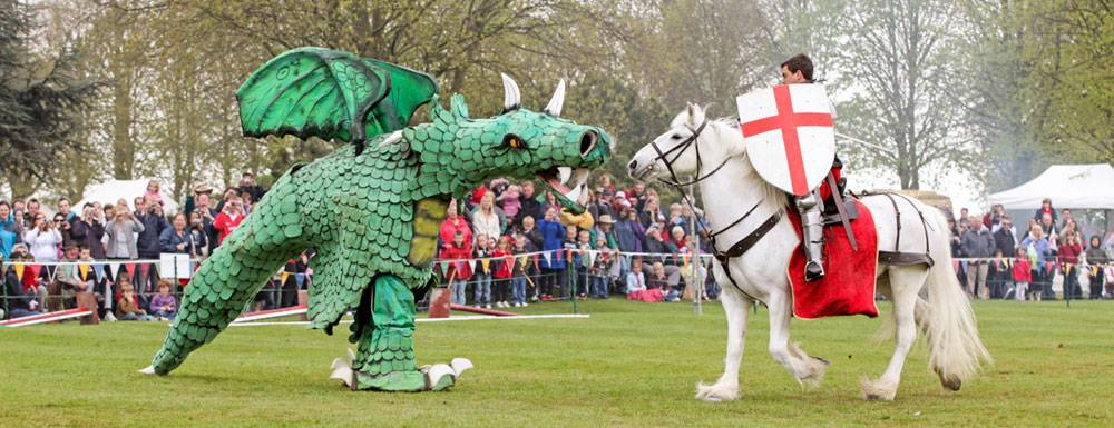 A battle between a St George and the dragon is played in the grounds of Beeston Castle