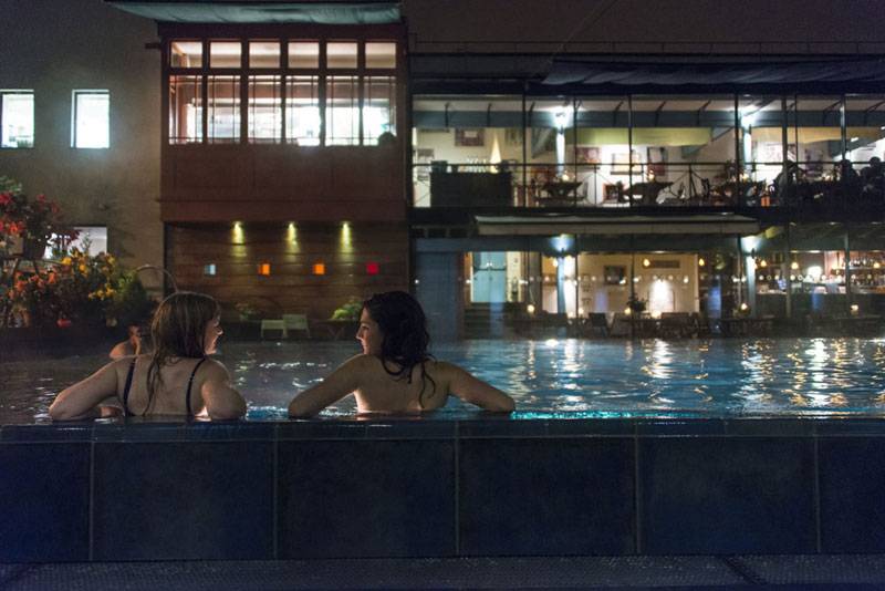 Two women relaxing in the pool at Lido in Bristol