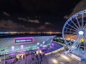 The view from the main entrance of the M&S Bank Arena with a ferries wheel on the right hand side. Liverpool, England.