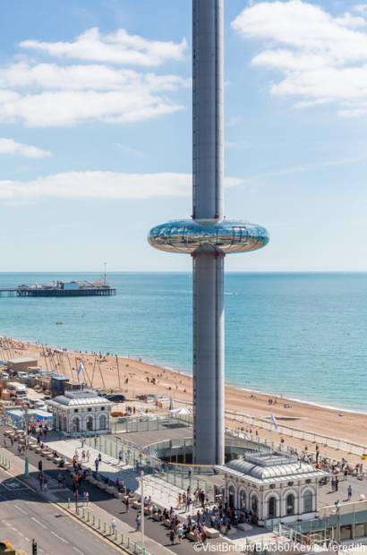  A view of BAi360 Tower on Brighton seafront with the beach in the foreground.