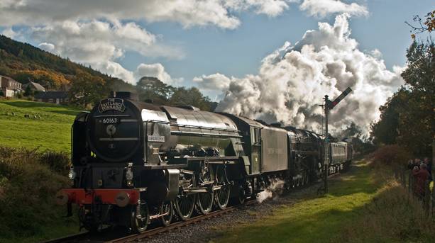 Steam train passing through Irwell Vale