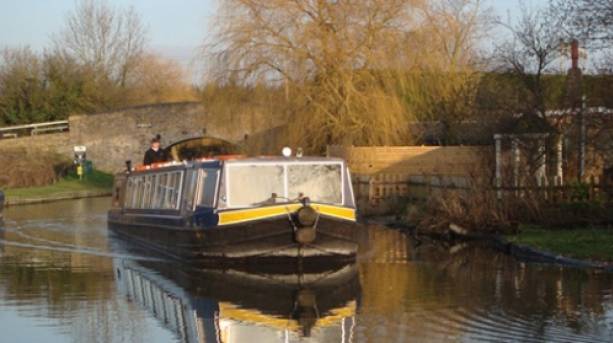 Covered boat on the Grand Union Canal, Buckinghamshire