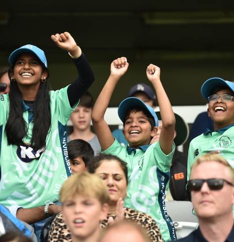 Children cheering on the cricket