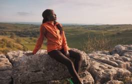 AJ Odudu posing on rocks in the Yorkshire Dales