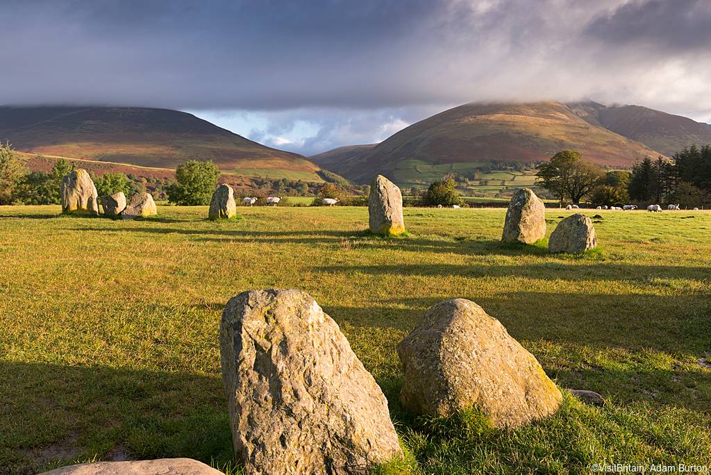 Castlerigg Stone Circle, a large eliptic stone circle of slate monoliths standing upright on a grass platea