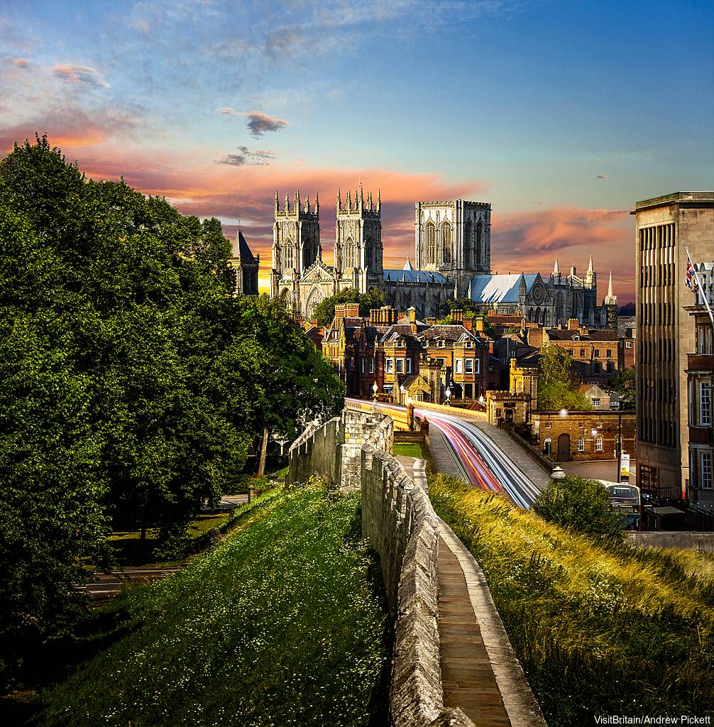The centre of York, surrounded by walls whose foundations date back to medieval times. There is a wall walk around the city. York Minster at sunset.