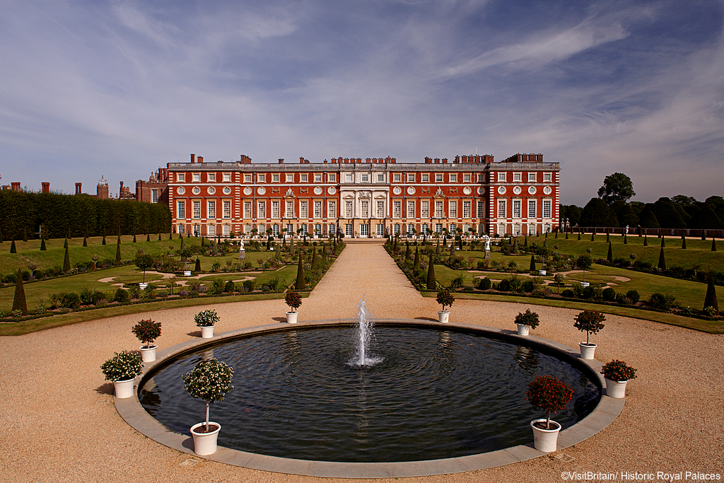 Hampton Court Palace is a historic royal palace built by Cardinal Wolsely. Building facade and gardens laid out in formal style.