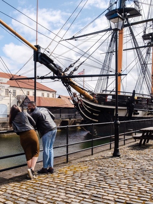 A woman and a man visiting a heritage naval museum