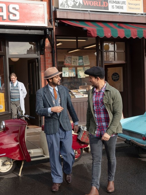 Customers talking outside an old style bookshop