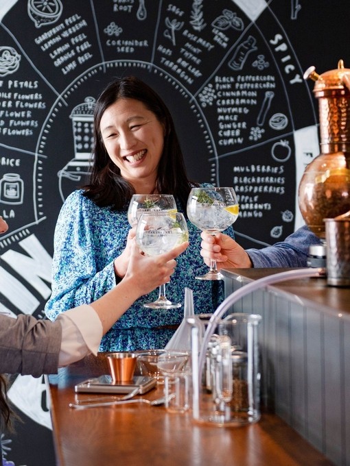 a girl in a wheelchair and her friends on a gin tasting distillery experience