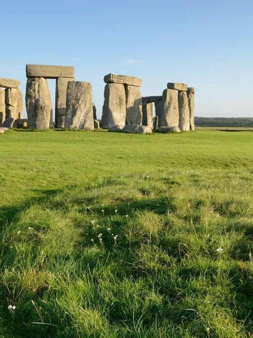 Large stone pillars arranged in circle on grass