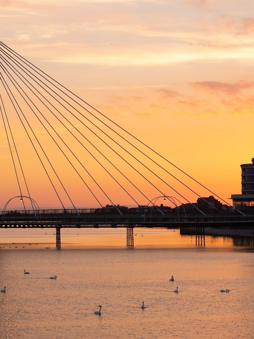 View of sunset over a lake in a seaside town