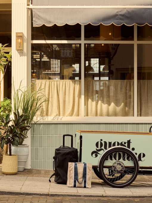 A luggage bike outside a luxury boutique seaside hotel.