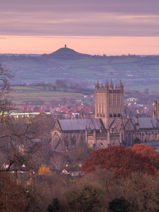 A dawn view of a majestic cathedral and town panorama