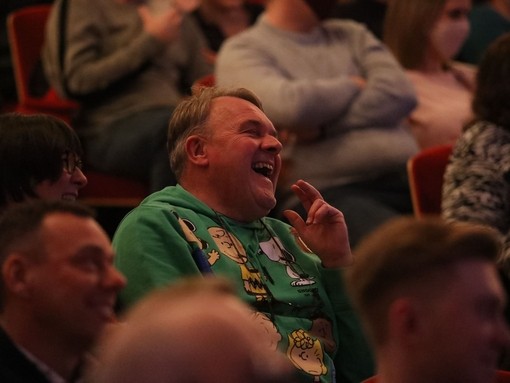 An audience member laughing during a show at Leicester's Comedy Festival