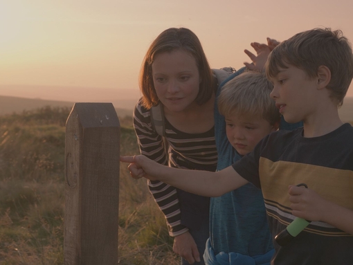 A mother and her two sons exploring the Dark Sky Discovery Trail in Exmoor Park