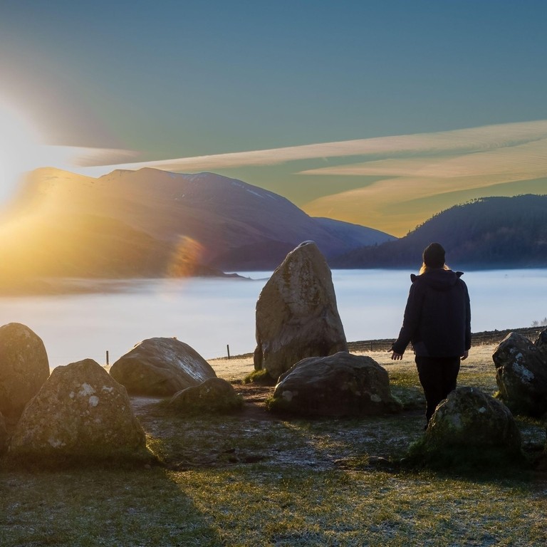 People attending the Winter Solstice celebration at Castelrigg Stone Circle near Keswick in Cumbria