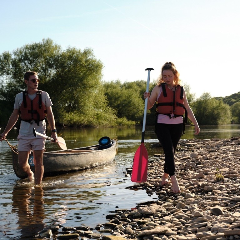 Two people canoeing on the River Wye