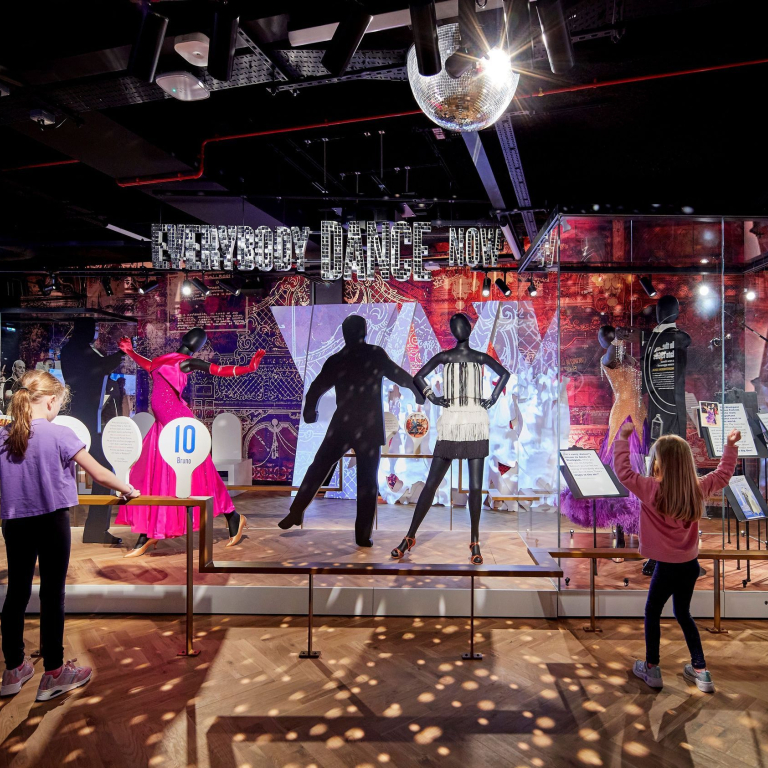 Children looking at a colourful museum exhibit.