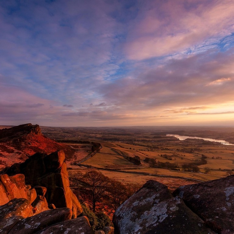 Hen Cloud and Tittesworth Reservoir from the Roaches at sunset. Peak District sandstone and the Staffordshire moorlands.