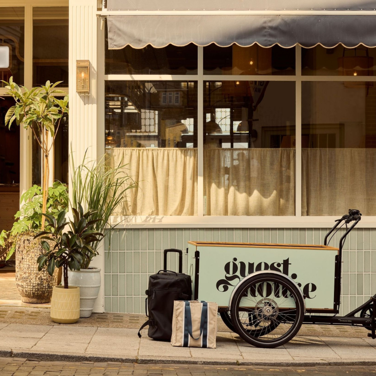 A luggage bike outside a luxury boutique seaside hotel.