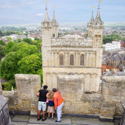 Aerial view of people looking down from a tower at Exeter Cathedral