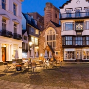 A quaint English town square in the evening.