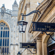 A view of the entrance to The Pump Room with a church in the background at an elegant upmarket restaurant.